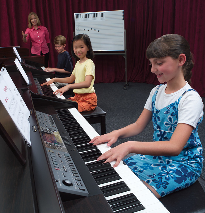 Student performers sharing the stage at a PANC recital