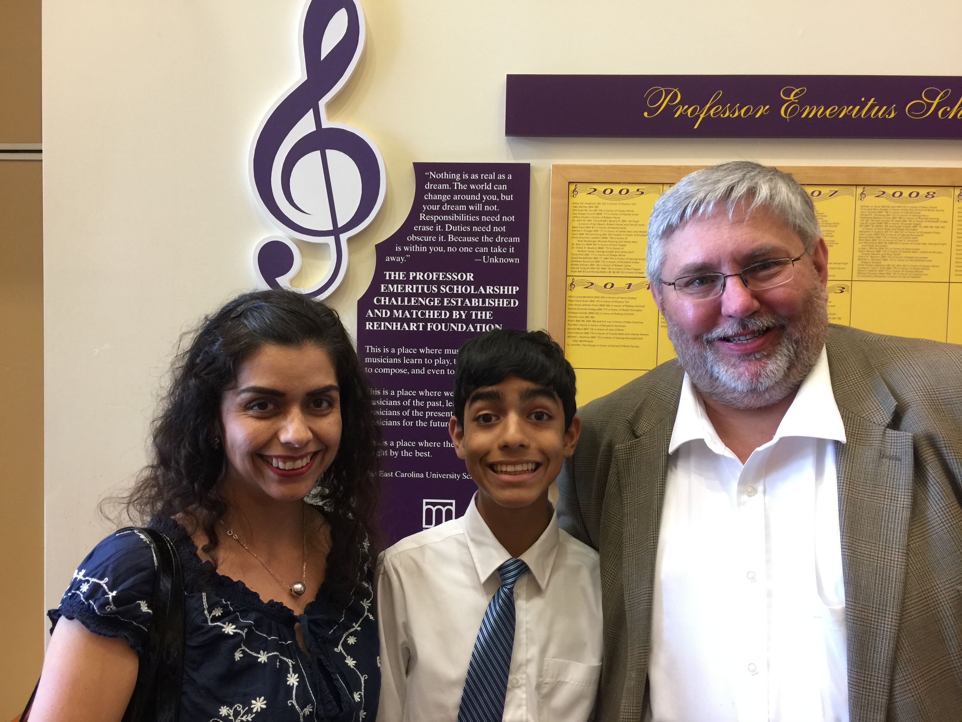 Current-site photograph of a pianist and attendees at a PANC performance